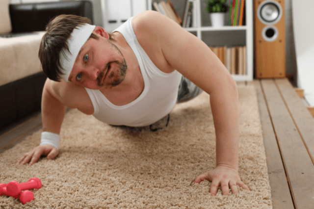unfit man trying to complete a push-up